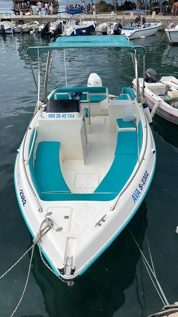 The Ava boat moored at the port of Sarandë