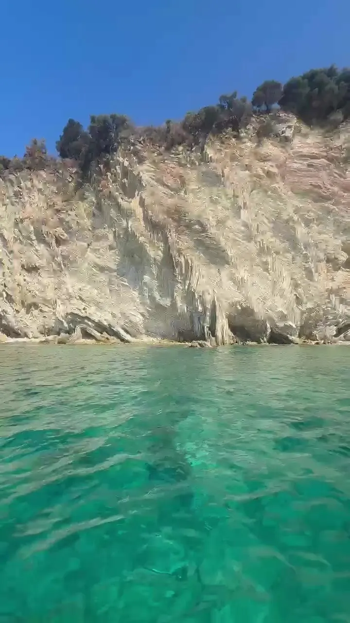 White cliff above clear turquoise water